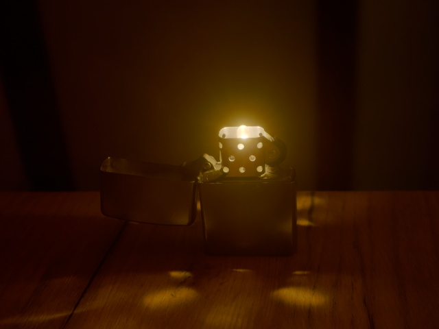 Photographic image of a 
    prominent brand windproof lighter having a light-emitting diode inserted 
    in place of the wick